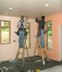 Electricians at work in the kitchen